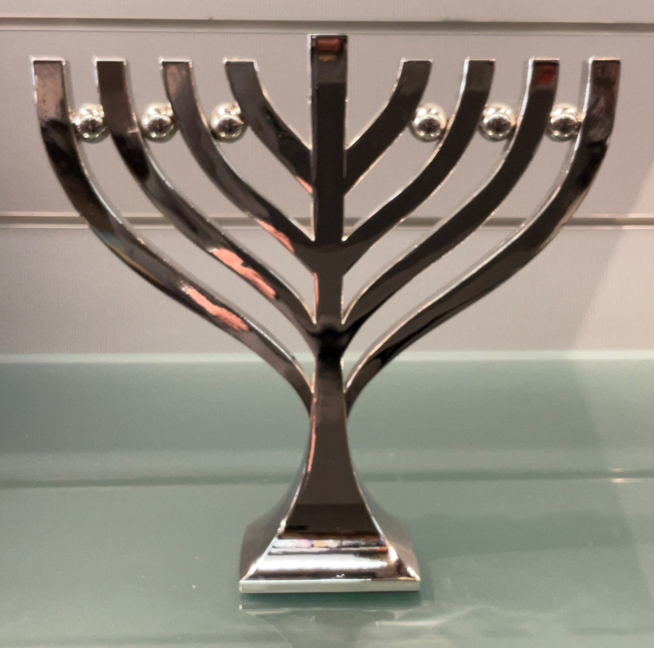 Menorah.      Highly polished aluminium